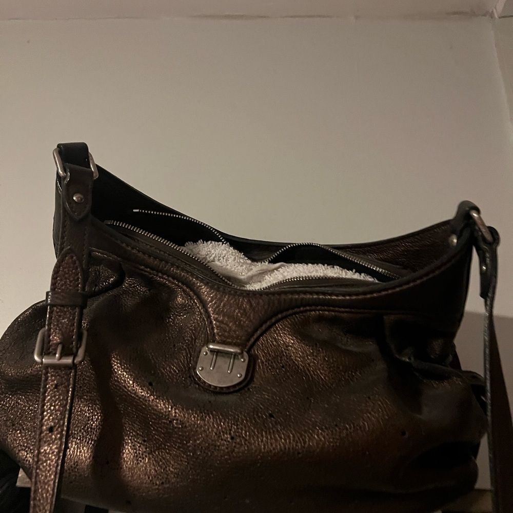 Louis Vuitton authentic mahina XS in Mordore metallic purplish.